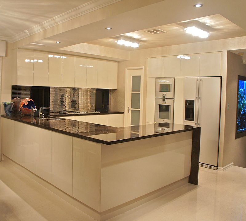 Full kitchen renovation in white gloss and granite